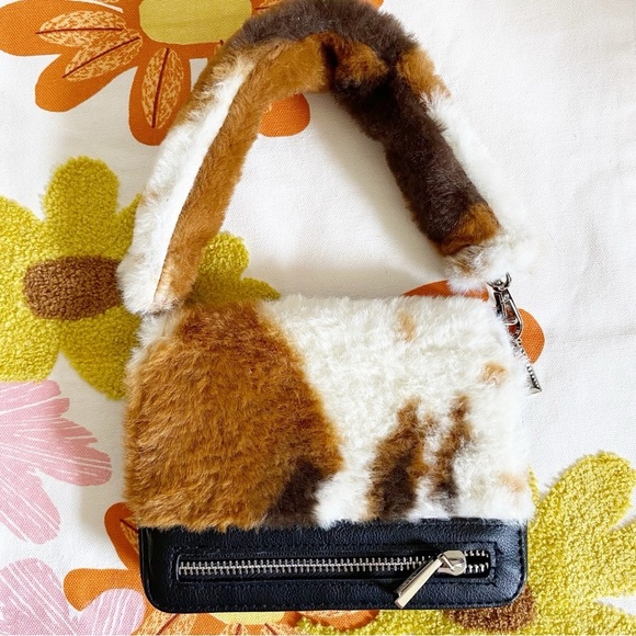 Handbags - NWOT Faux Fur Cow Print Mini Handbag